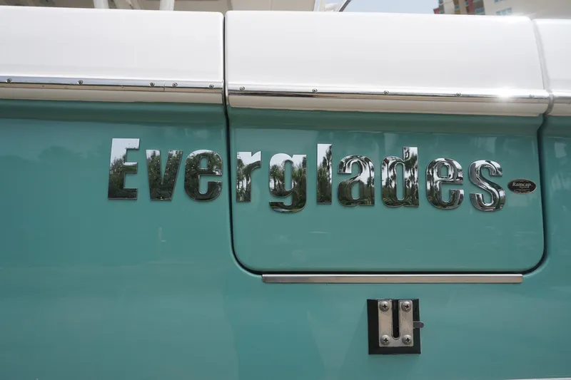Slide: The Image of Everglades 355 CCX 2017 boat logo on teal background. - 24