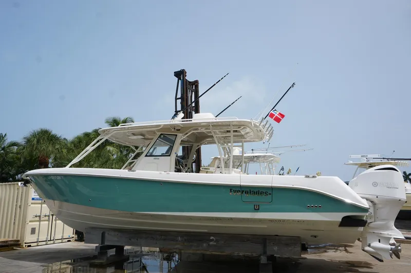 Slide: The Image of 2017 Everglades 355 CCX boat on display, featuring a sleek design and vibrant hull. - 25