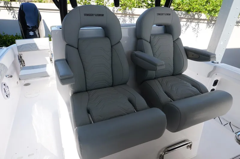 Slide: The Image of 2023 Twin Vee 280 GFX CC boat seats, gray leather, modern design. - 10