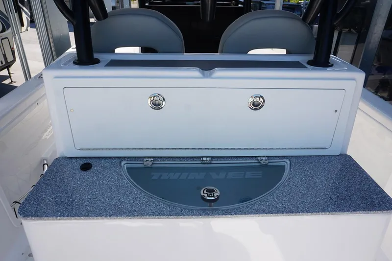 Slide: The Image of 2023 Twin Vee 280 GFX CC boat interior with storage compartments. - 13