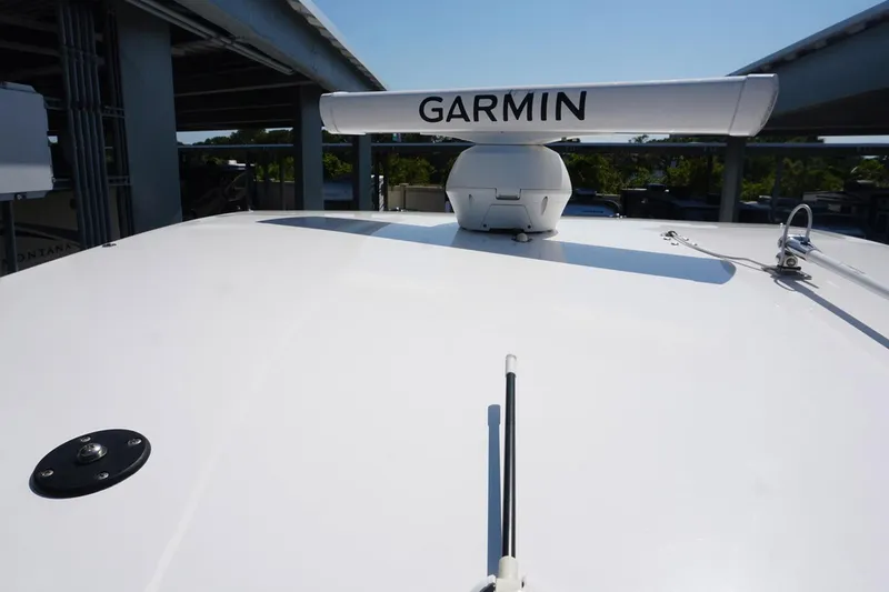 Slide: The Image of 2023 Twin Vee 280 GFX CC boat with Garmin radar system on deck. - 14