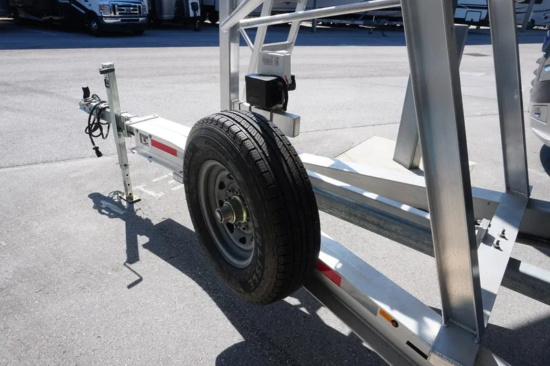 Slide: The Image of Trailer for 2023 Twin Vee 280 GFX CC boat with spare tire and hitch. - 30