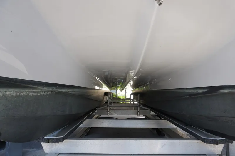 Slide: The Image of 2023 Twin Vee 280 GFX CC boat hull on trailer, viewed from below. - 31