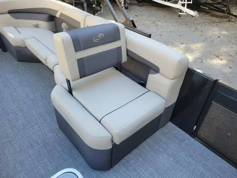 Slide: The Image of 2025 Barletta C22Q pontoon boat interior with beige and gray seating. - 11