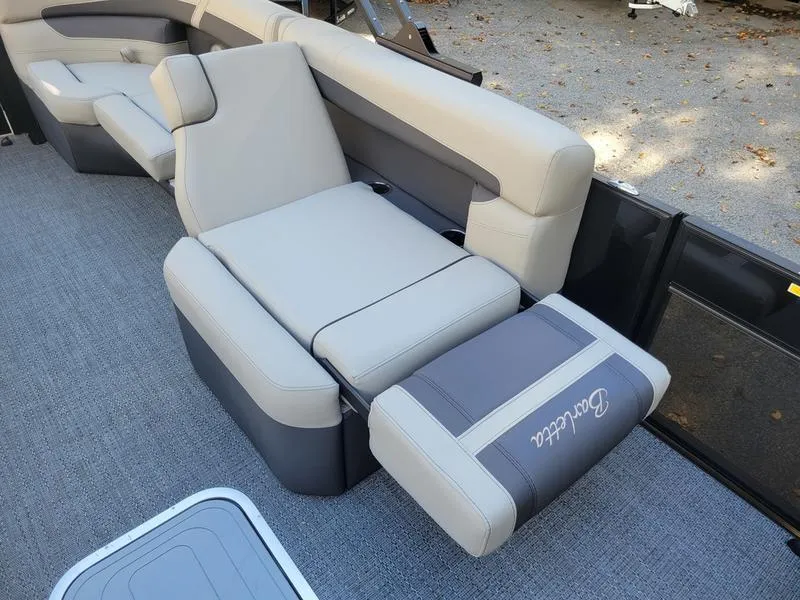 Slide: The Image of 2025 Barletta C22Q boat interior with luxurious seating and modern design. - 13