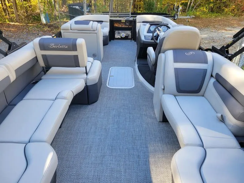 Slide: The Image of 2025 Barletta C22Q pontoon boat interior with spacious seating and modern design. - 16