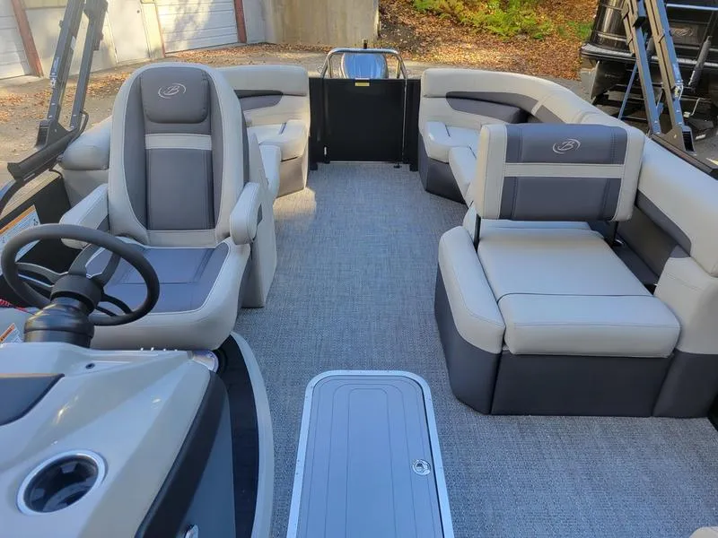 Slide: The Image of 2025 Barletta C22Q pontoon boat interior with plush seating and modern design. - 18