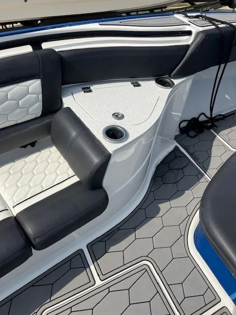 Slide: The Image of 2022 Fountain 39 NX boat interior with black and white seating and hexagonal flooring. - 12