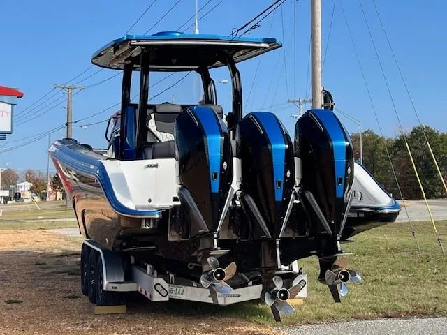 Slide: The Image of 2022 Fountain 39 NX boat with triple outboard engines on a trailer. - 4