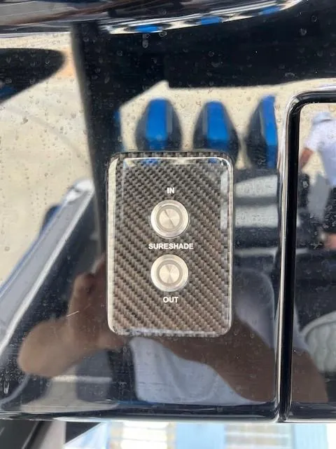 Slide: The Image of Carbon fiber control panel on 2022 Fountain 39 NX boat with SureShade buttons. - 9