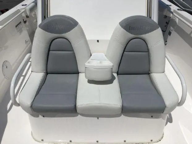 Slide: The Image of 2015 Everglades 295 Center Console boat seats, gray and white upholstery. - 19