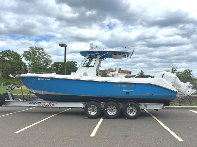 Slide: The Image of 2015 Everglades 295 Center Console boat on trailer in parking lot. - 3