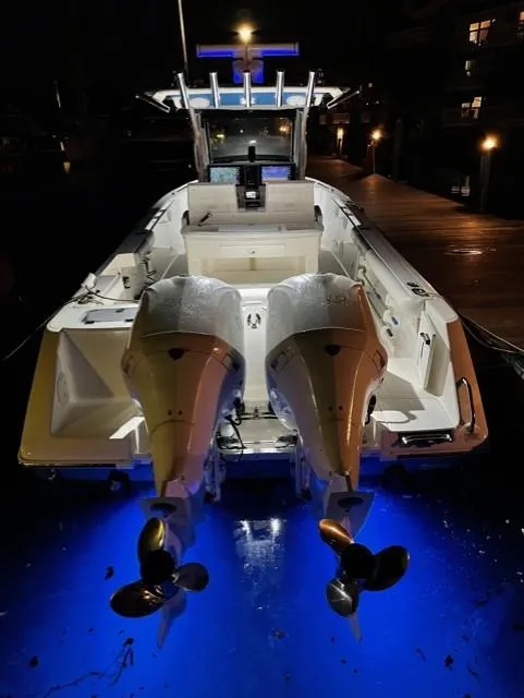 Slide: The Image of 2015 Everglades 295 Center Console boat with illuminated twin engines at night. - 5