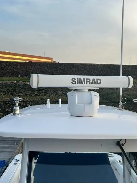 Slide: The Image of 2015 Everglades 295 Center Console with Simrad radar system. - 9