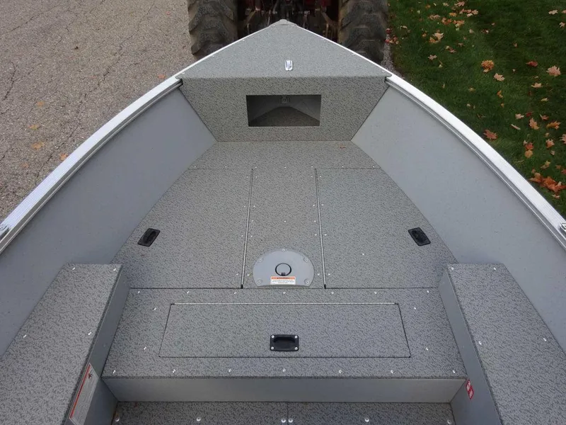 Slide: The Image of 2025 Lund 1600 Fury Heritage Edition boat interior with gray textured flooring. - 10