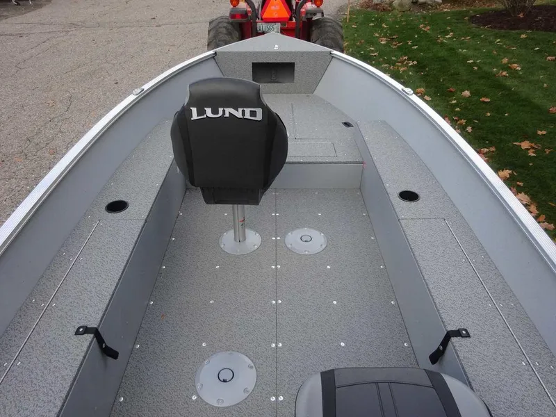 Slide: The Image of 2025 Lund 1600 Fury Heritage Edition boat interior with seating and storage compartments. - 4