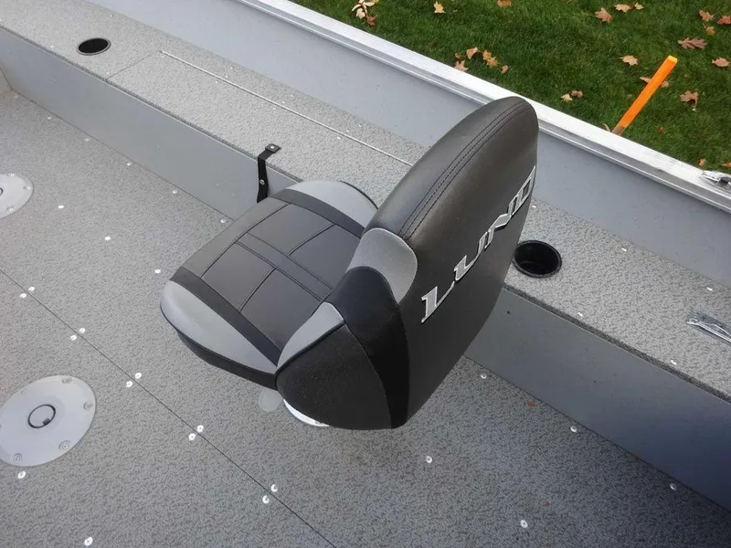 Slide: The Image of 2025 Lund 1600 Fury Heritage Edition boat seat, gray and black design, on deck. - 5