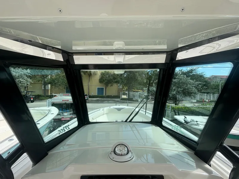 Slide: The Image of Interior view of 2025 Sailfish 272 CC boat cockpit with clear windows. - 11