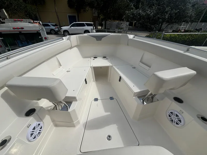 Slide: The Image of 2025 Sailfish 272 CC boat interior with spacious seating and storage compartments. - 14