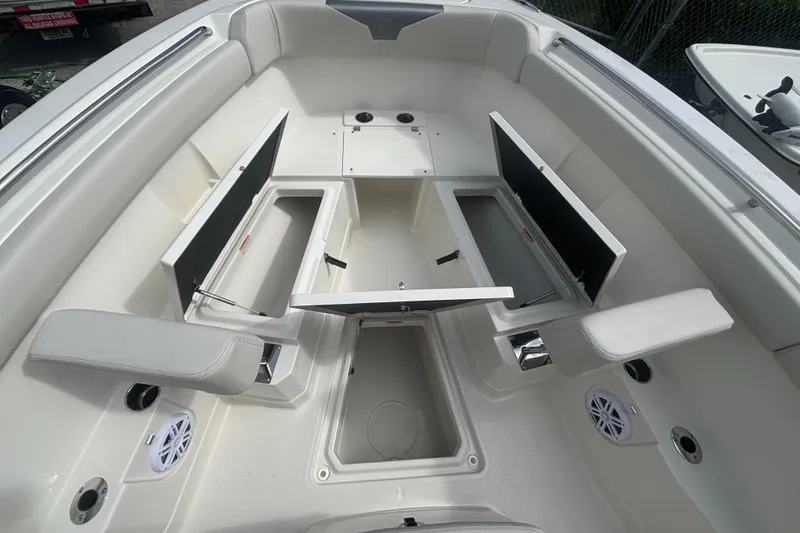 Slide: The Image of 2025 Sailfish 272 CC boat interior with open storage compartments and seating. - 16
