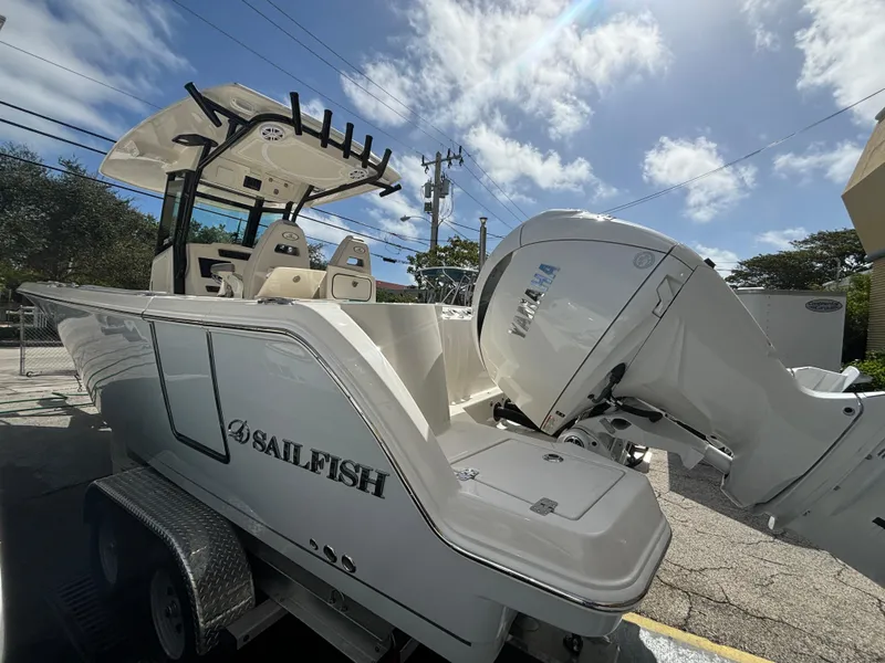 Slide: The Image of 2025 Sailfish 272 CC boat on trailer under clear sky. - 3