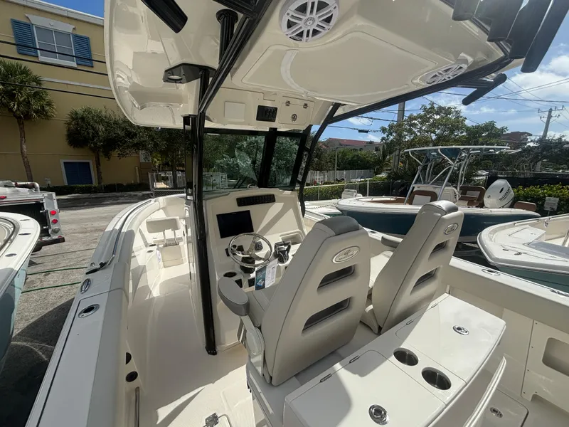 Slide: The Image of 2025 Sailfish 272 CC boat interior with dual seats and steering console. - 8