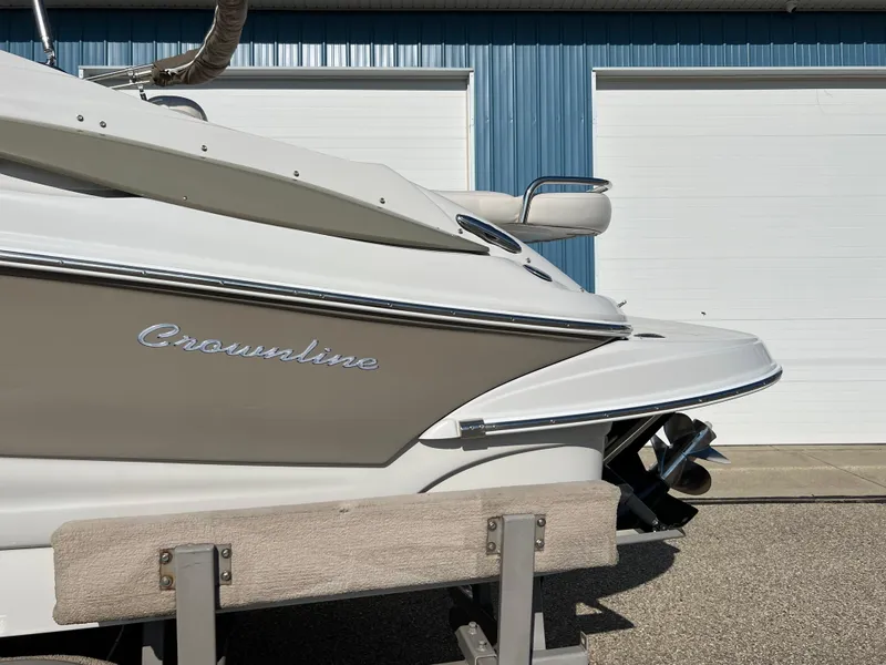 Slide: The Image of 2006 Crownline 260 LS boat in front of blue garage doors. - 19