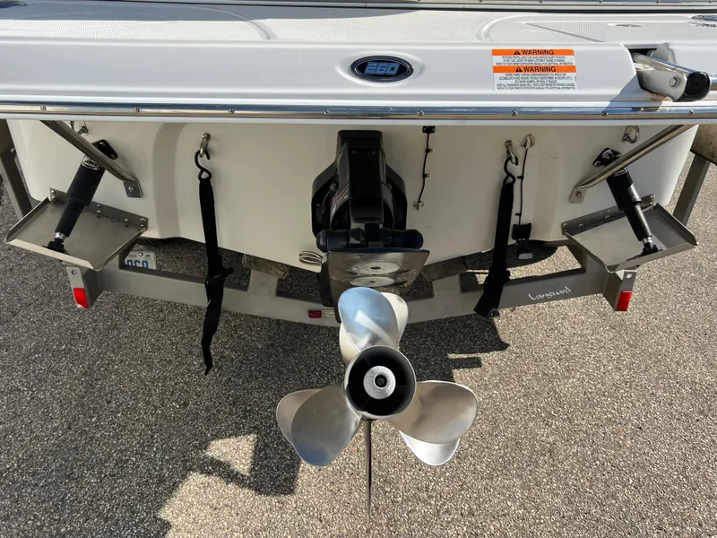 Slide: The Image of 2006 Crownline 260 LS boat stern with propeller and trim tabs. - 30