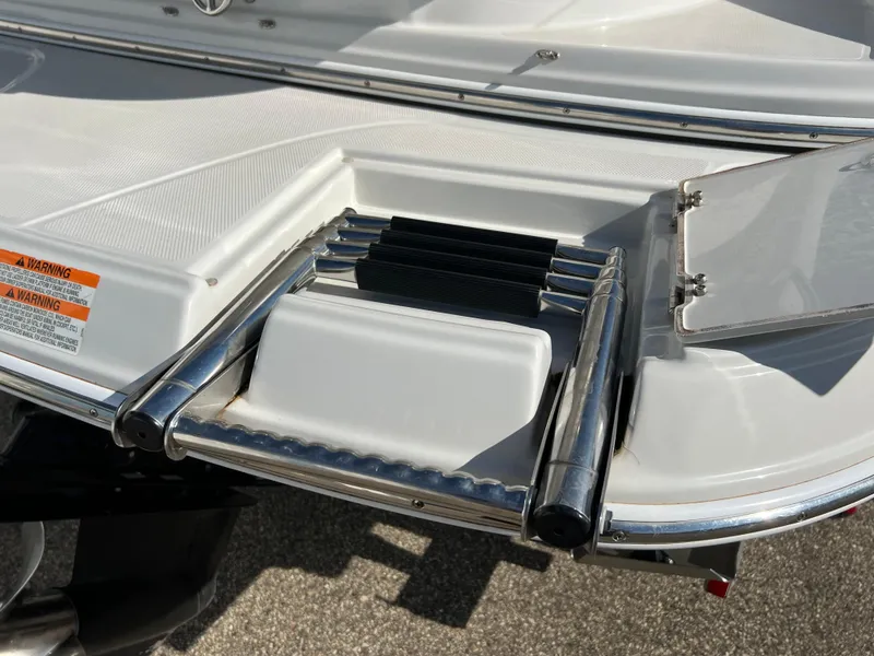 Slide: The Image of 2006 Crownline 260 LS boat with foldable swim ladder. - 31