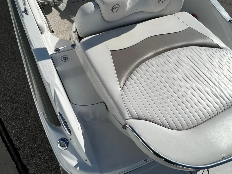 Slide: The Image of 2006 Crownline 260 LS boat interior with white and gray seating. - 32