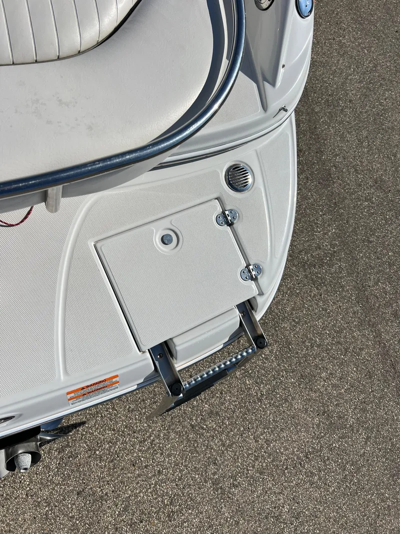 Slide: The Image of 2006 Crownline 260 LS boat swim platform with ladder and seating detail. - 33