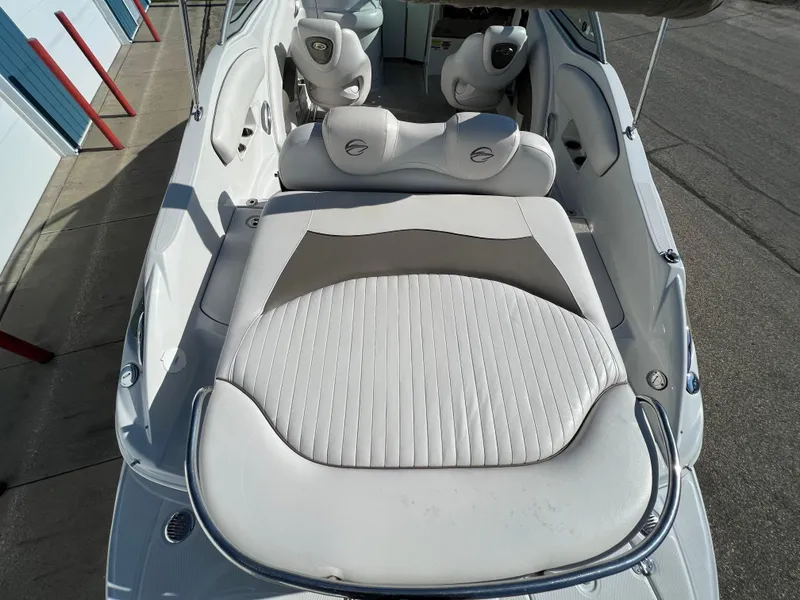 Slide: The Image of 2006 Crownline 260 LS boat interior with white seating and sleek design. - 34