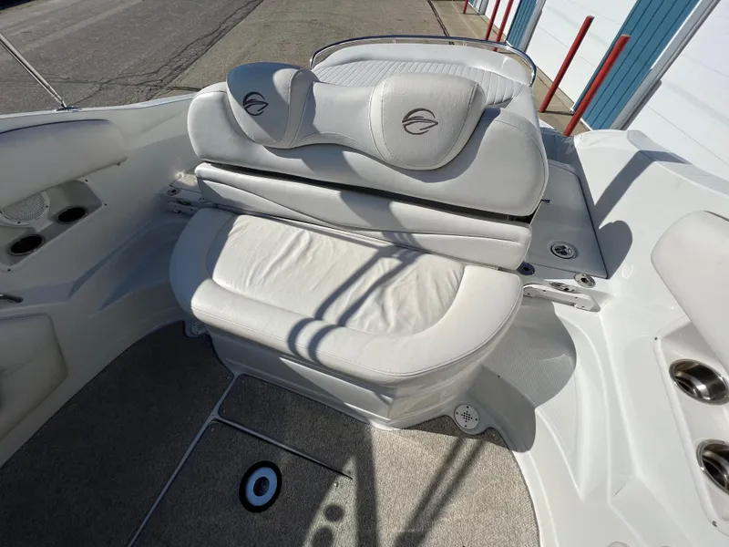 Slide: The Image of 2006 Crownline 260 LS boat interior with white cushioned seating. - 39