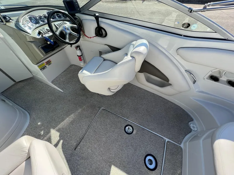Slide: The Image of 2006 Crownline 260 LS boat interior with steering wheel and seating. - 40