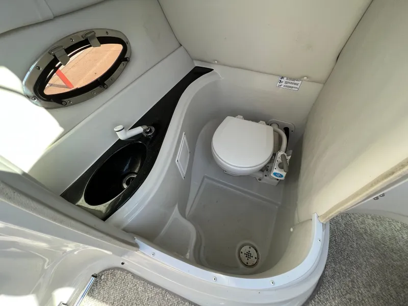Slide: The Image of 2006 Crownline 260 LS boat bathroom with sink and toilet. - 43
