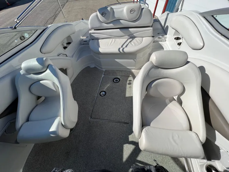 Slide: The Image of Interior of a 2006 Crownline 260 LS boat with white leather seating. - 44