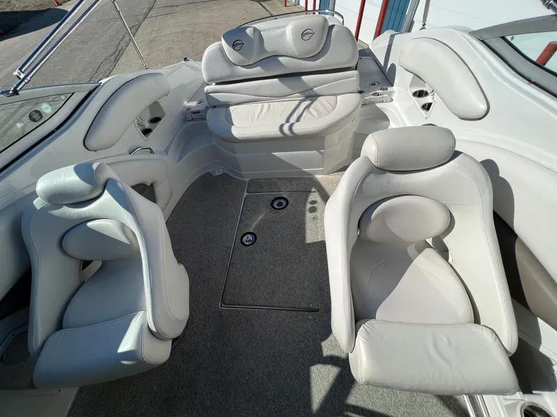 Slide: The Image of 2006 Crownline 260 LS boat interior with plush white seating and carpeted floor. - 45