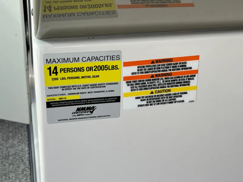 Slide: The Image of Capacity warning label on 2006 Crownline 260 LS boat, maximum 14 persons or 2005 lbs. - 47