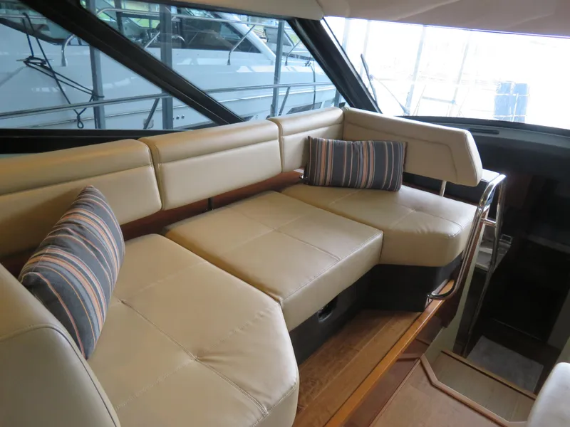 Slide: The Image of Luxurious interior seating of 2015 Sea Ray 470 Sundancer yacht with striped cushions. - 15