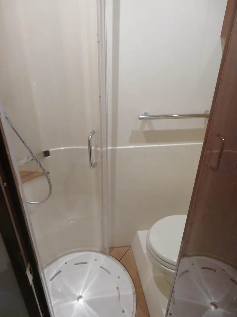 Slide: The Image of Bathroom interior of 2015 Sea Ray 470 Sundancer yacht with shower and toilet. - 9