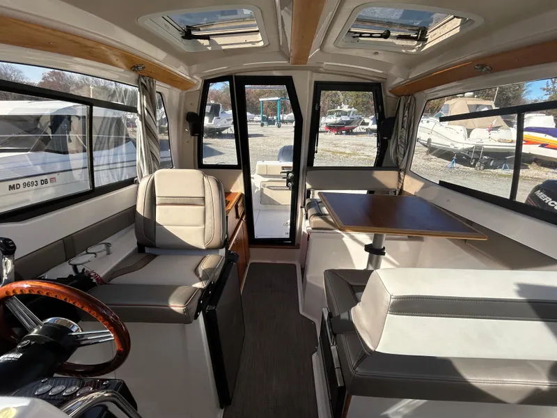 Slide: The Image of Interior of 2021 Cutwater C-24 Coupe boat with seating and table. - 4