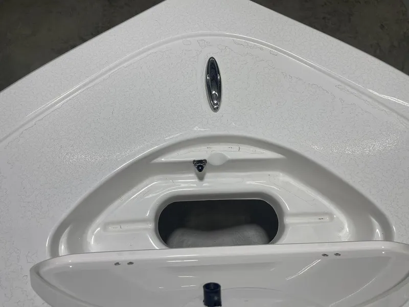 Slide: The Image of 2025 Tidewater 210 LXF boat bow with storage compartment, white finish. - 12