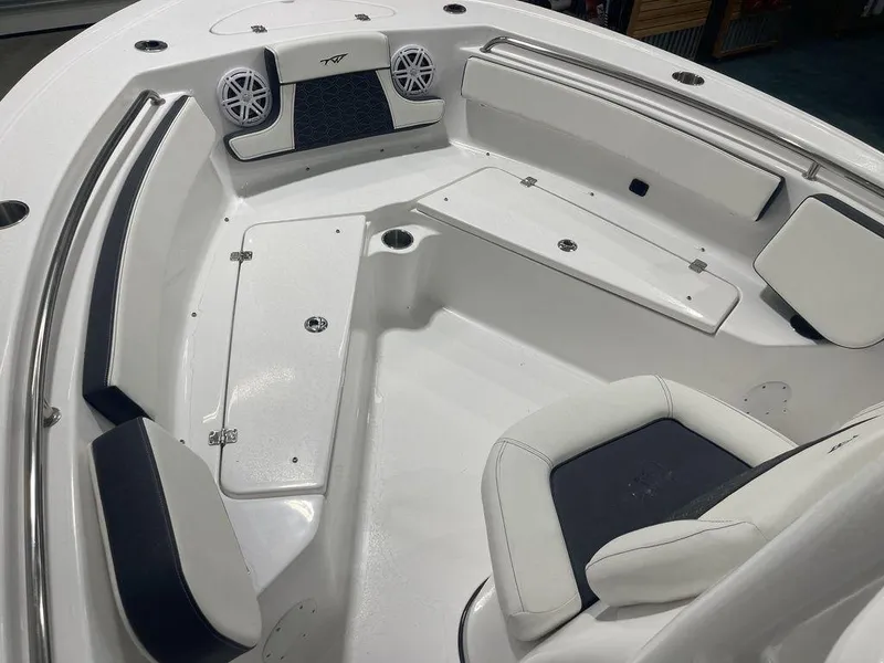 Slide: The Image of 2025 Tidewater 210 LXF boat interior with seating and speakers. - 14