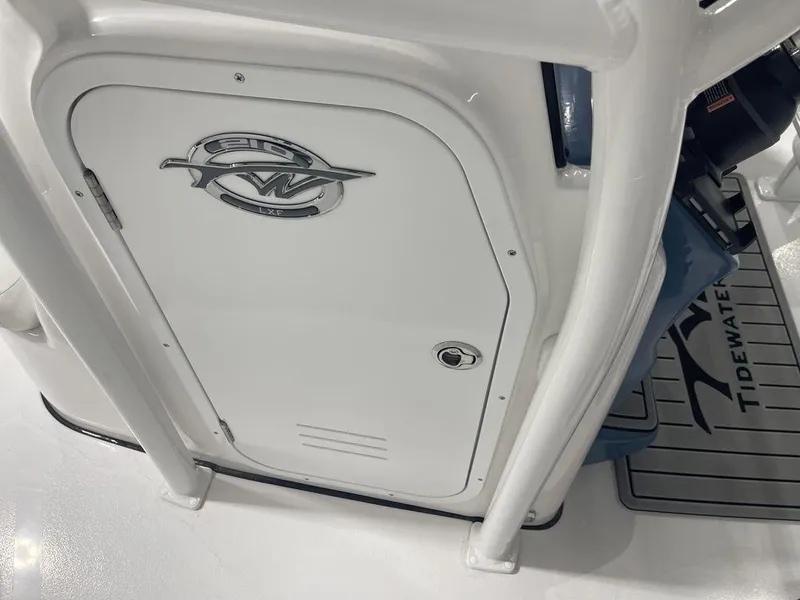 Slide: The Image of 2025 Tidewater 210 LXF boat interior, featuring sleek design and logo detail. - 15