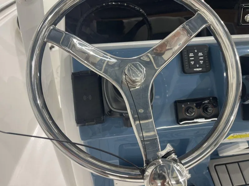 Slide: The Image of Steering wheel of 2025 Tidewater 210 LXF boat with control panel. - 20