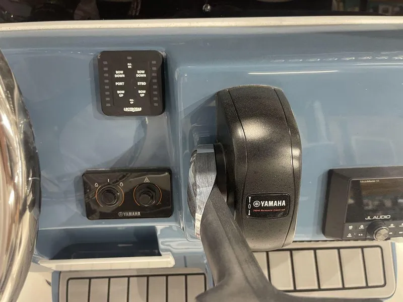 Slide: The Image of 2025 Tidewater 210 LXF boat dashboard with Yamaha controls and JL Audio system. - 21