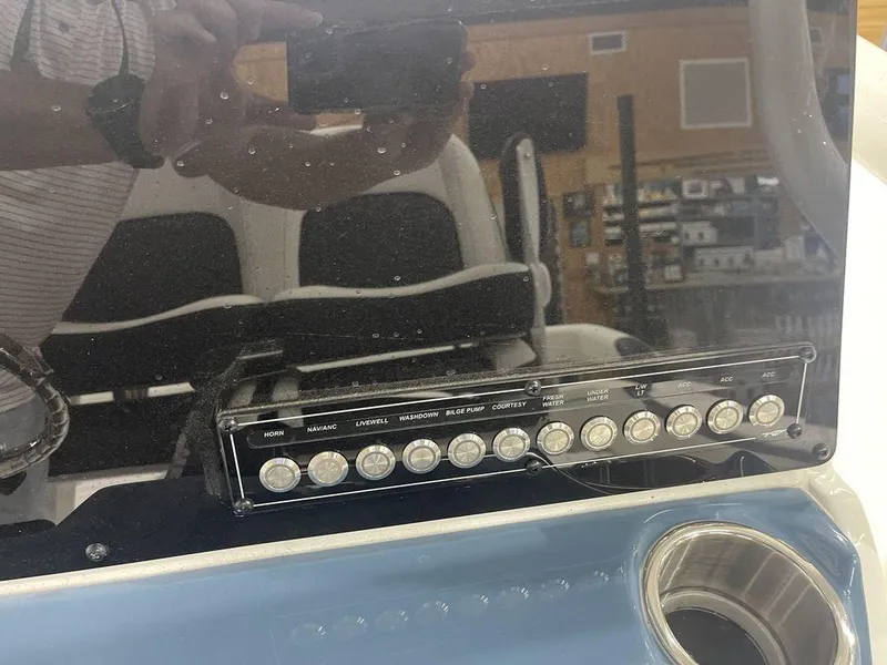 Slide: The Image of Control panel of a 2025 Tidewater 210 LXF boat with reflection. - 23