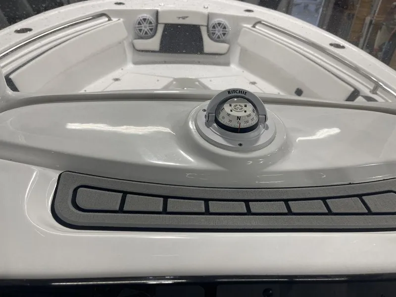 Slide: The Image of 2025 Tidewater 210 LXF boat interior with compass and speakers. - 24