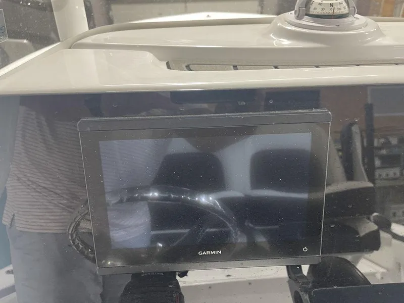 Slide: The Image of Garmin display on 2025 Tidewater 210 LXF boat dashboard with compass. - 25