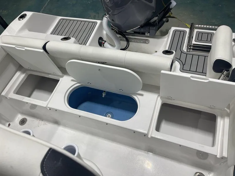 Slide: The Image of 2025 Tidewater 210 LXF boat interior with storage compartments and seating. - 30